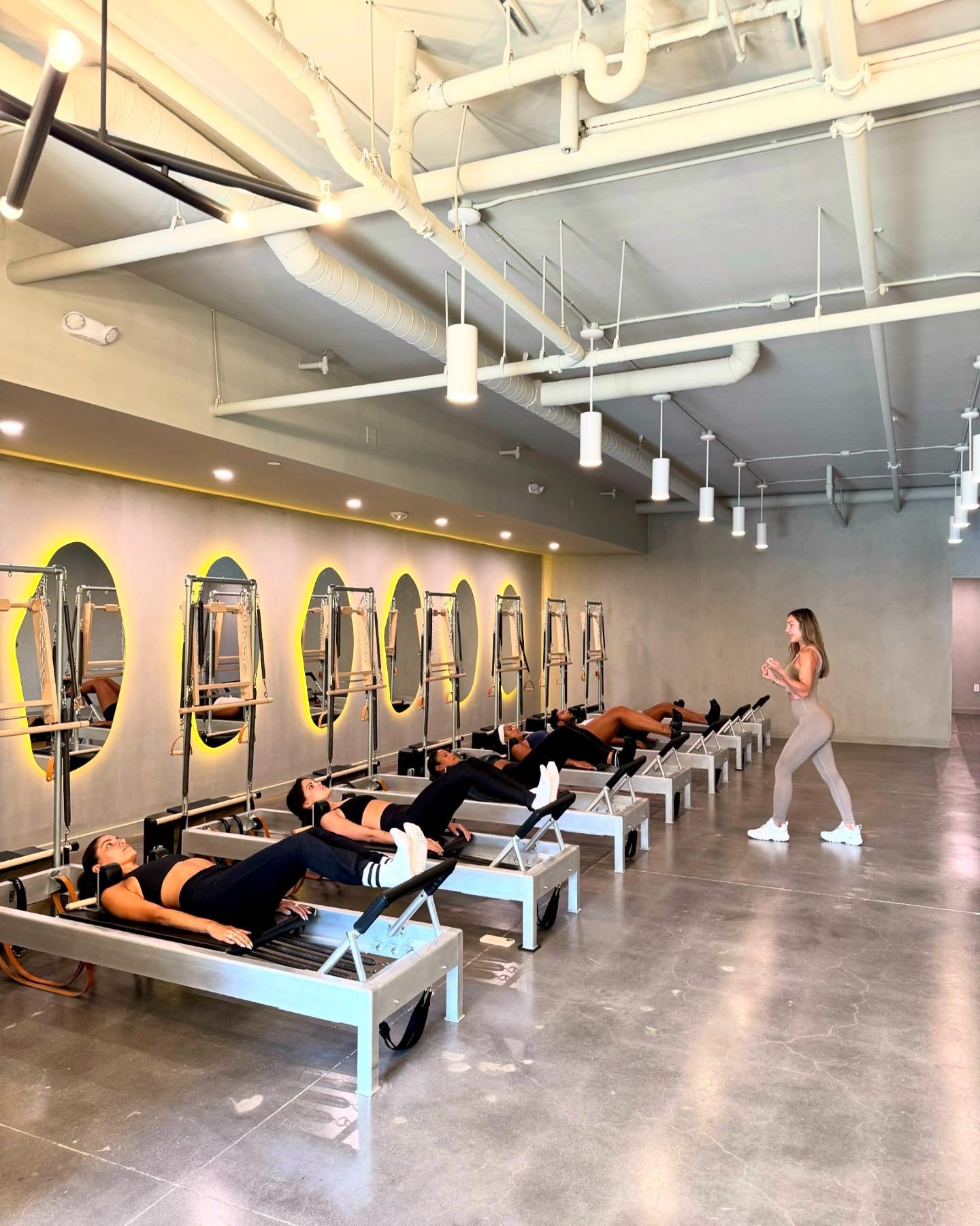 Boutique fitness studio instructor with client